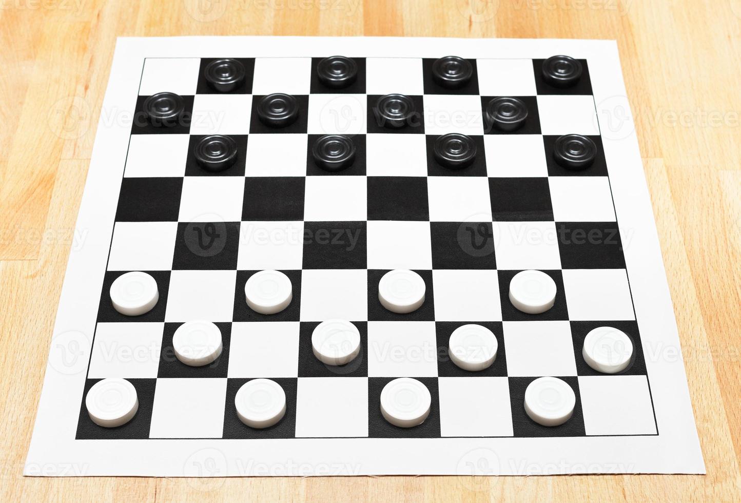 Starting position on vinyl checkers board photo