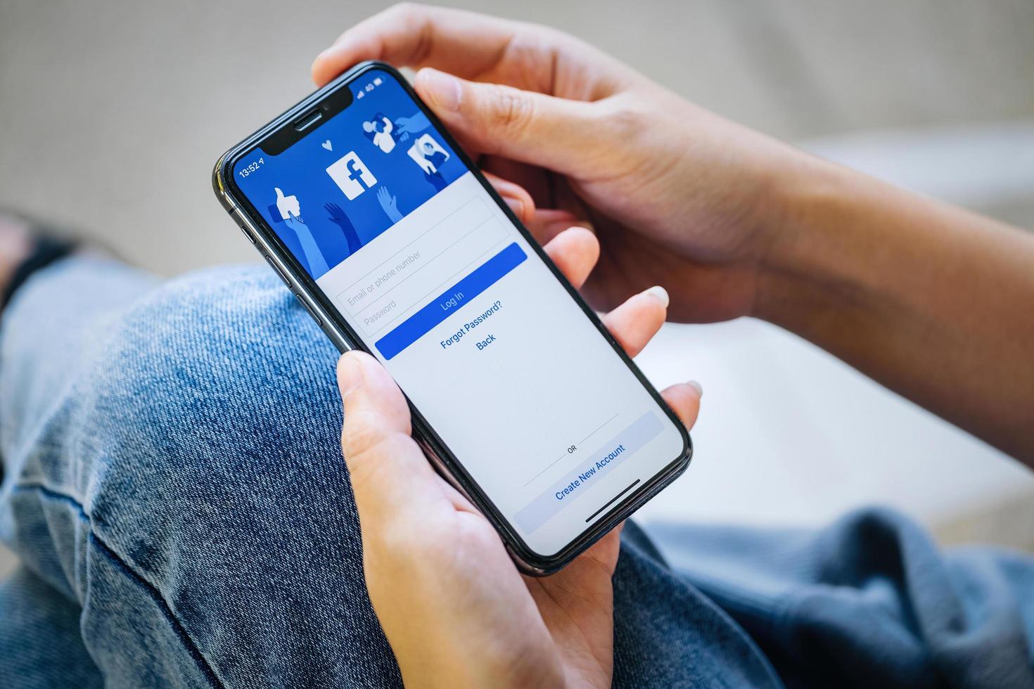 Chiang Mai Thailand. NOV  28, 2021. Woman holds  smart phone with facebook application on the screen. facebook is a photo-sharing app for smartphones. photo