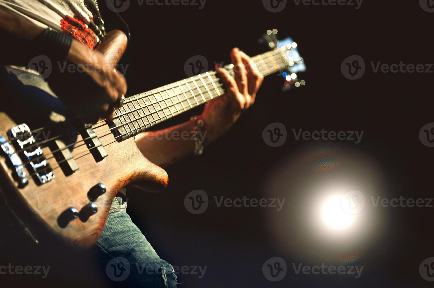 Electric Bass played during a concert photo