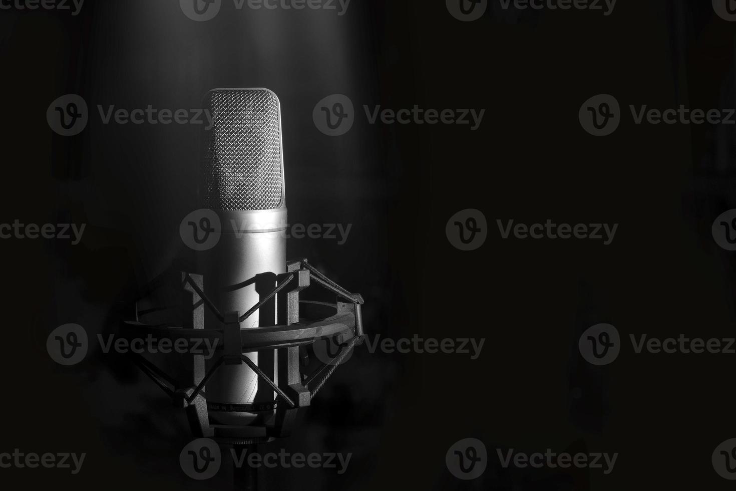 Studio microphone for singer on a black background photo