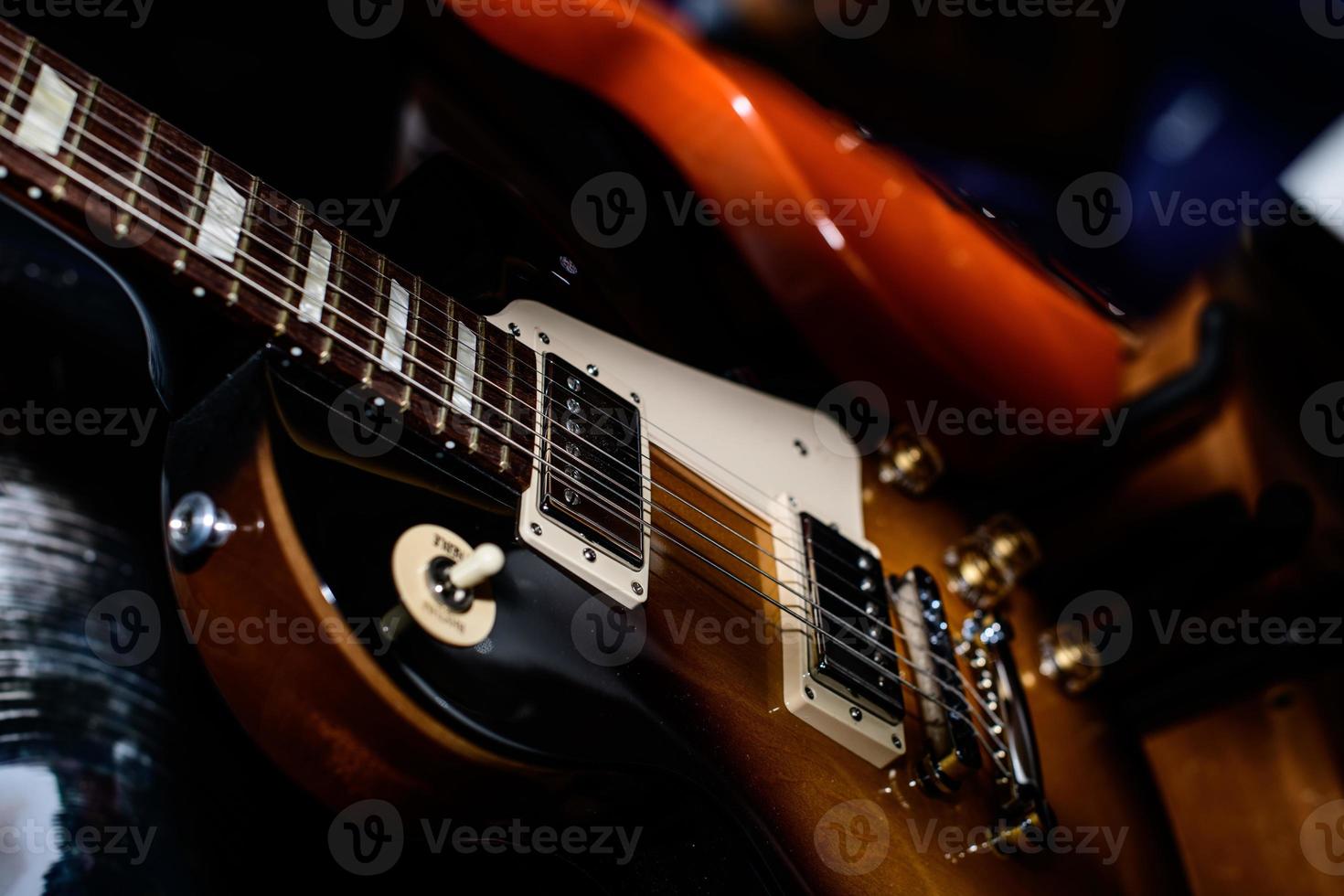 Electric guitar resting on the stage during a show photo