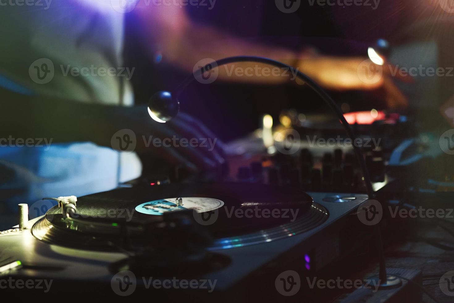 Disc jockey in action during 80's vintage party photo