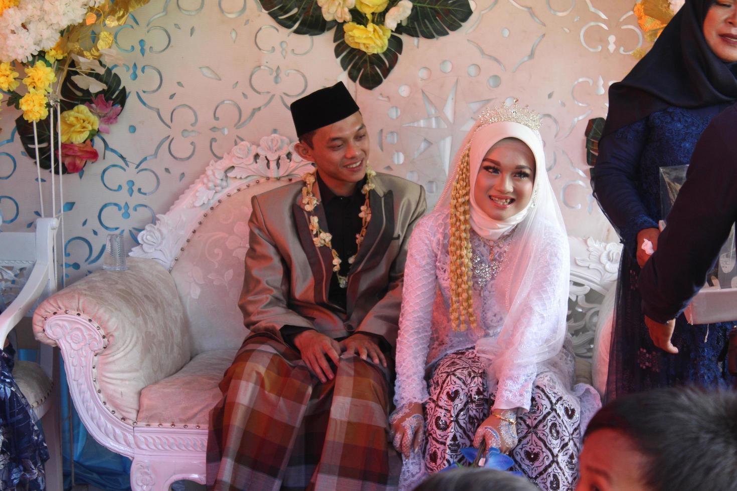 Cianjur Regency West Java Indonesia on June 12, 2021 - A happy couple.  Indonesian Muslim Wedding. photo