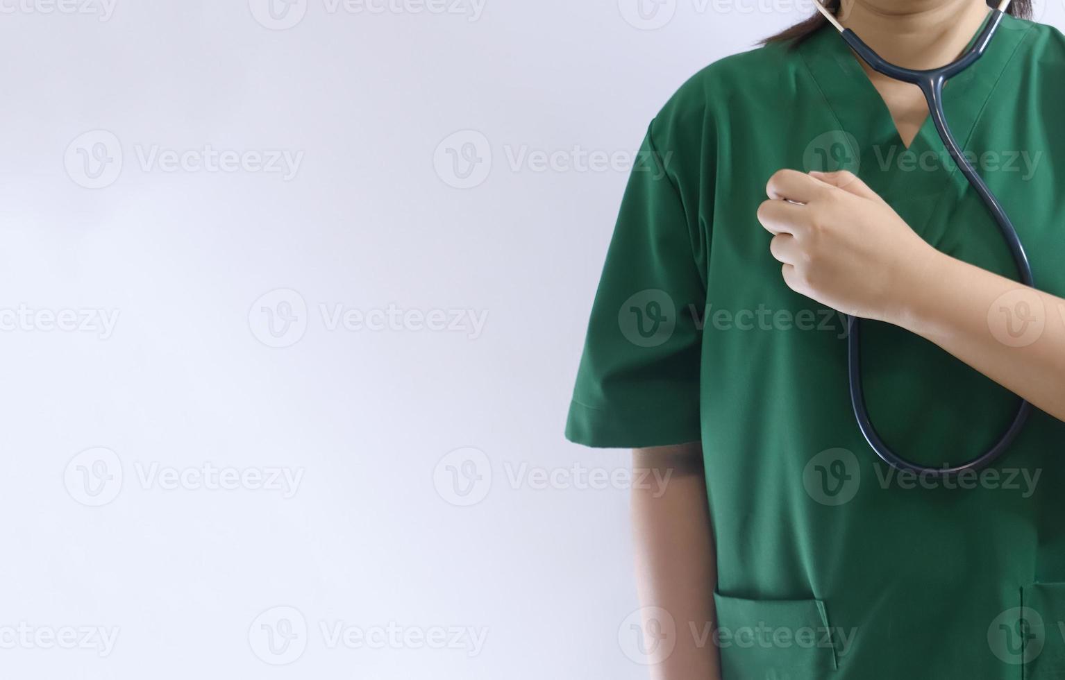 Midsection Of Doctor Gesturing While Standing Against Wall photo