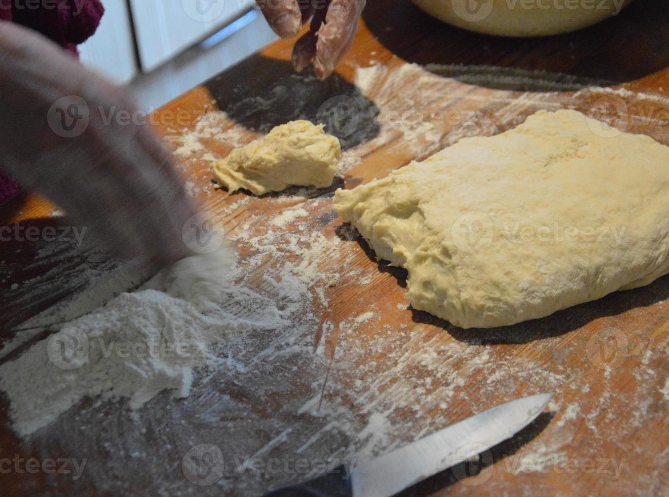 Cooking homemade whites with meat on yeast dough photo