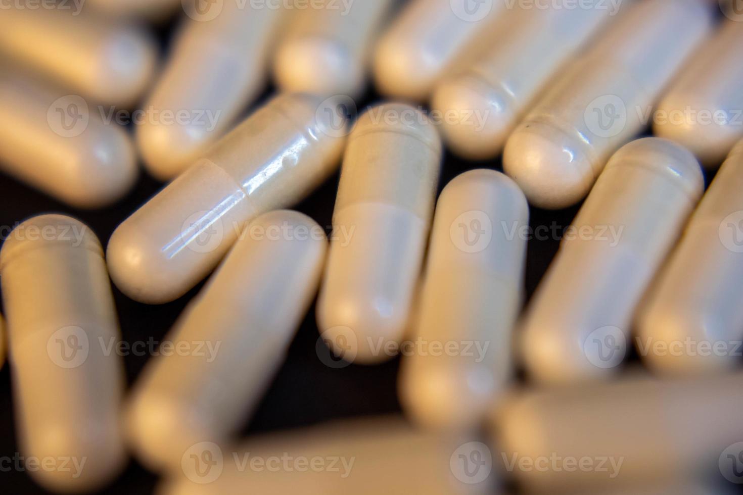 pills on black background photo