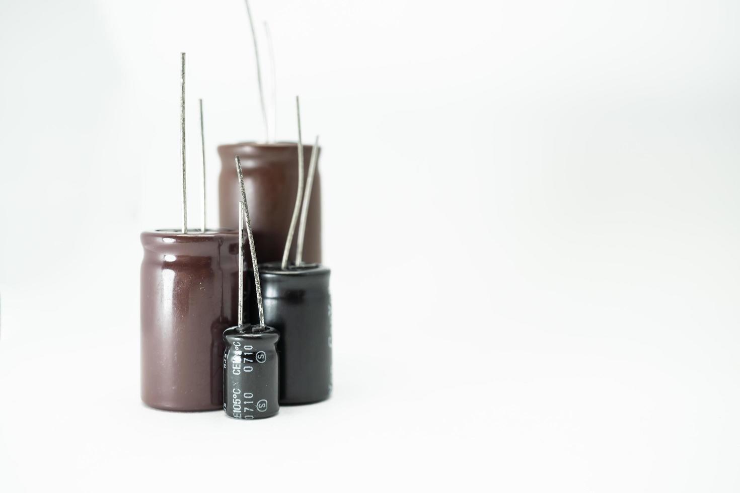 Isolated group of capacitor, used in electronic device. Electronic parts concept. photo