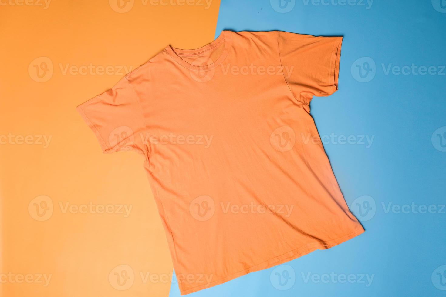T-shirt mockup on colorful background. Flat lay tee template photo