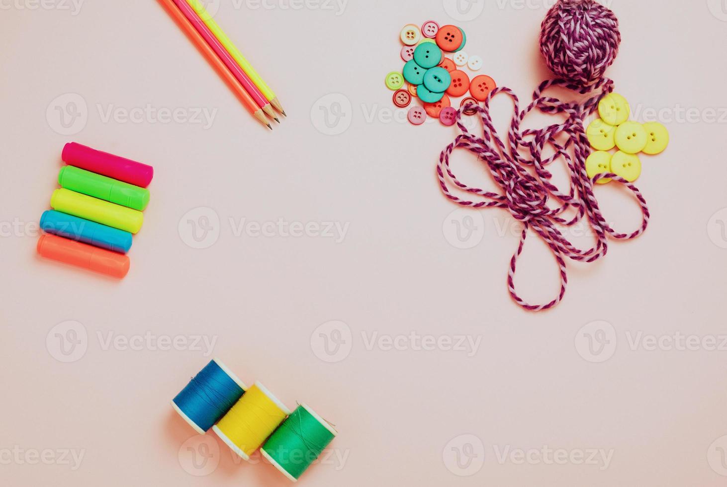 Creative flat lay of hobby time and art tools on a colorful pink background. Copy space photo