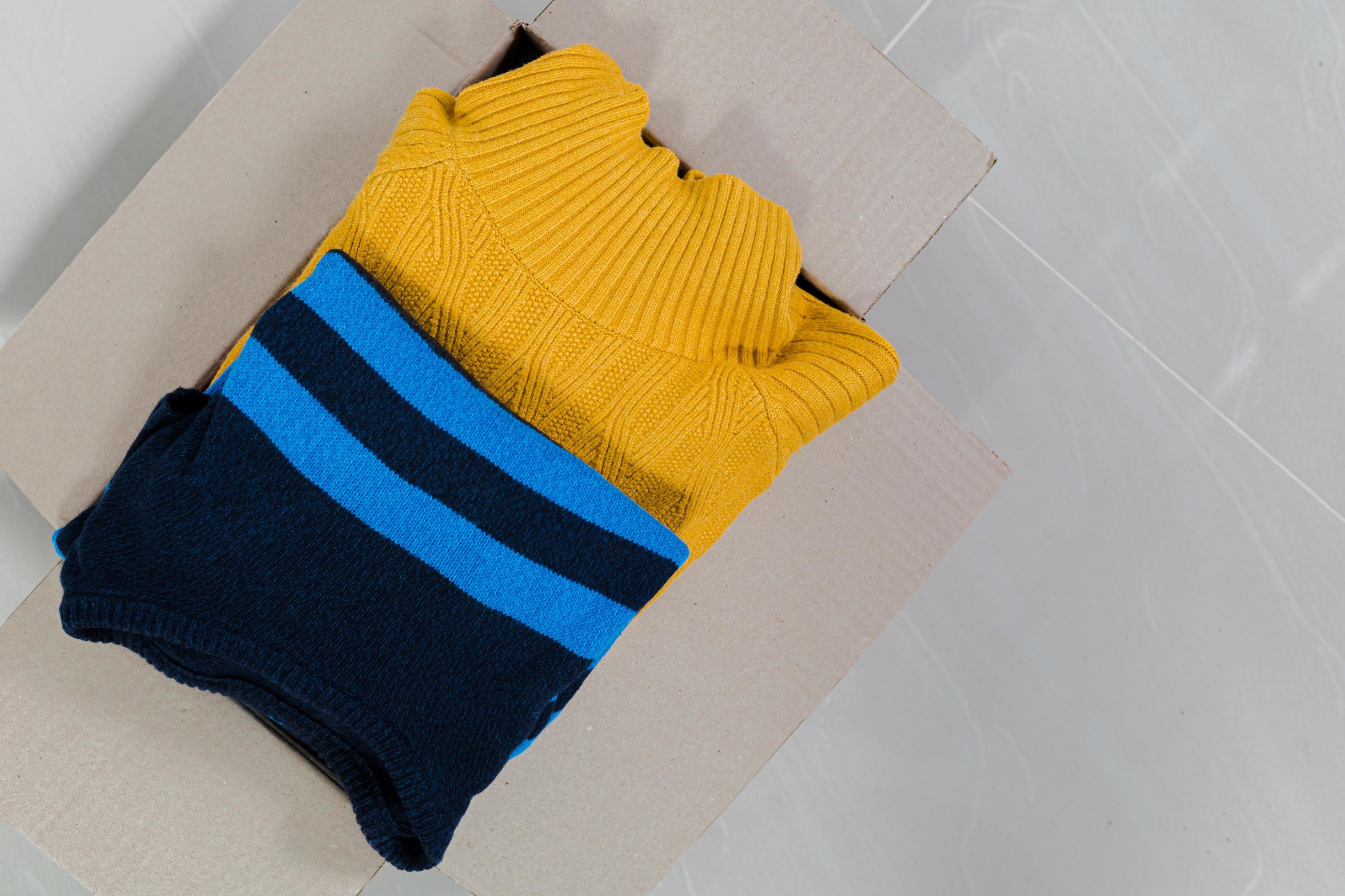 secondhand clothes crate unused clothes 11974353 Stock Photo at Vecteezy
