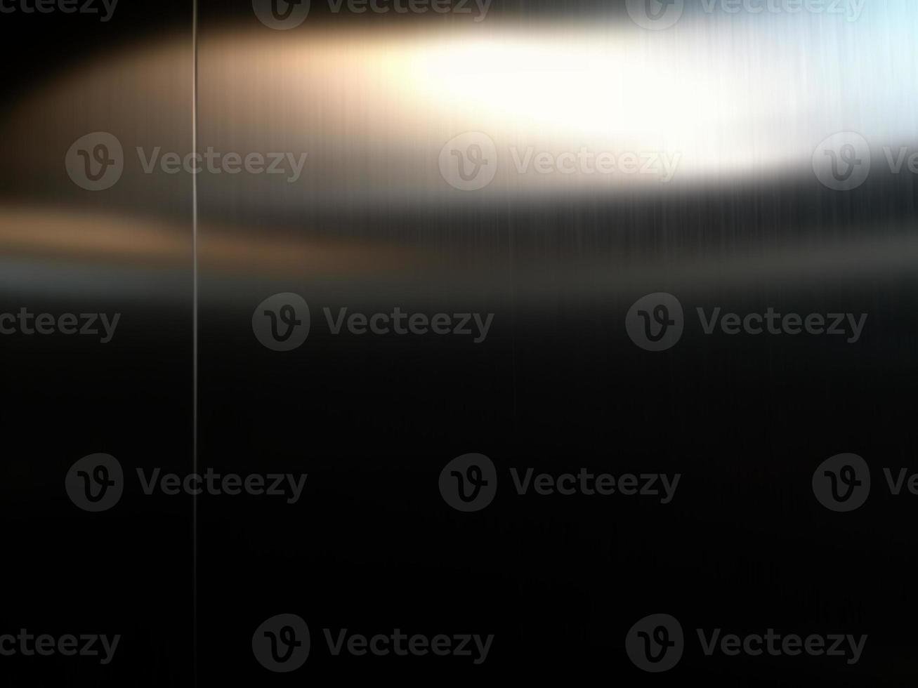 Stainless steel large sheet  With light hitting the surface  For background,Inside passenger elevator,Reflection of light on a shiny metal texture,stainless steel background. photo