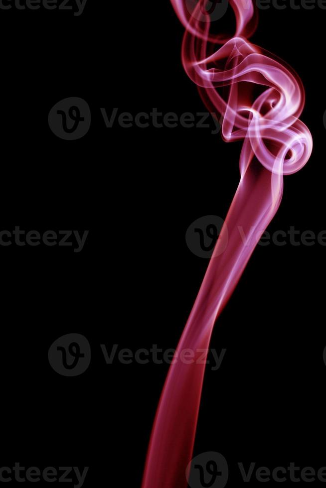 Red smoke on black background photo