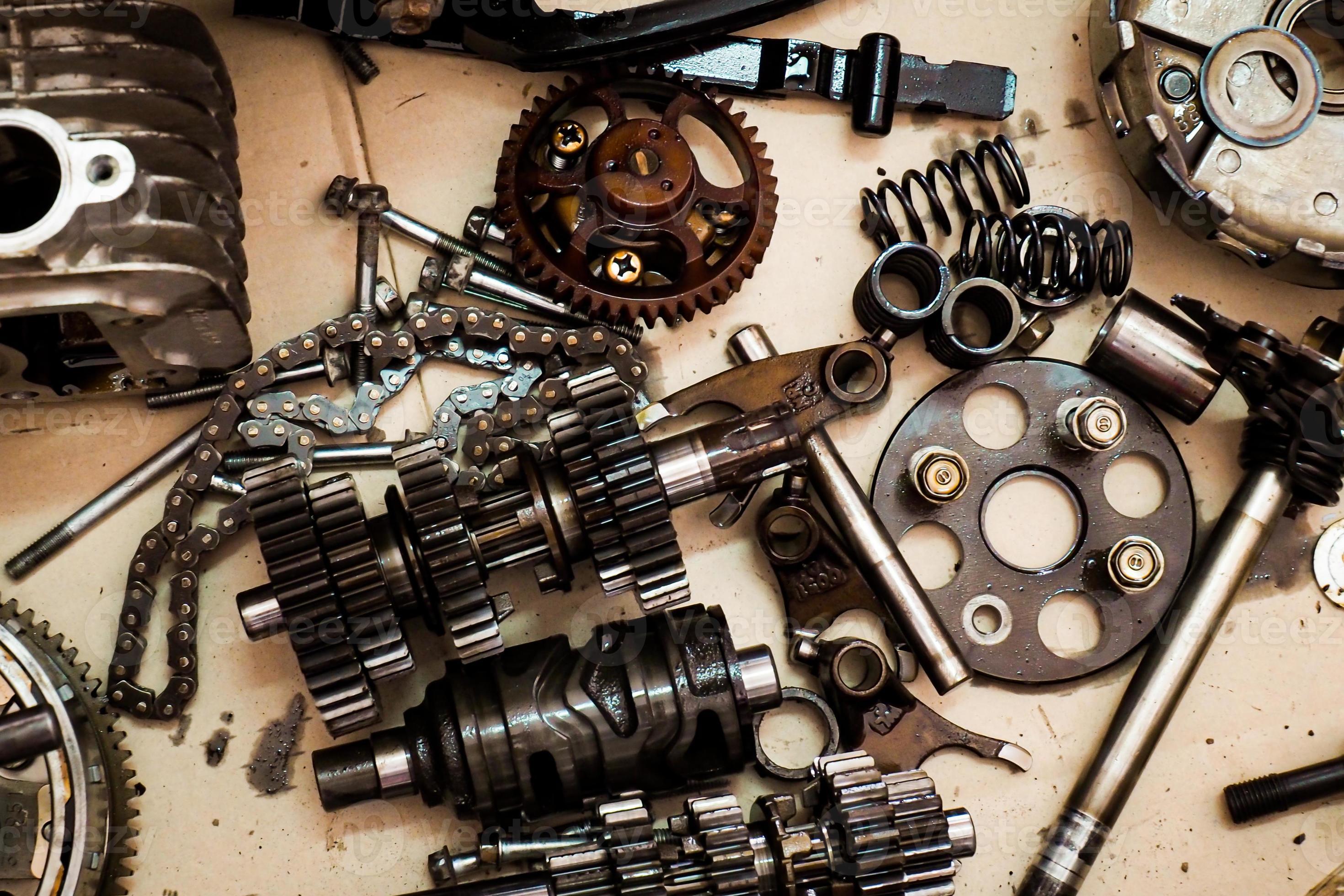 Parts of a motorcycle engine removed for maintenance. engine