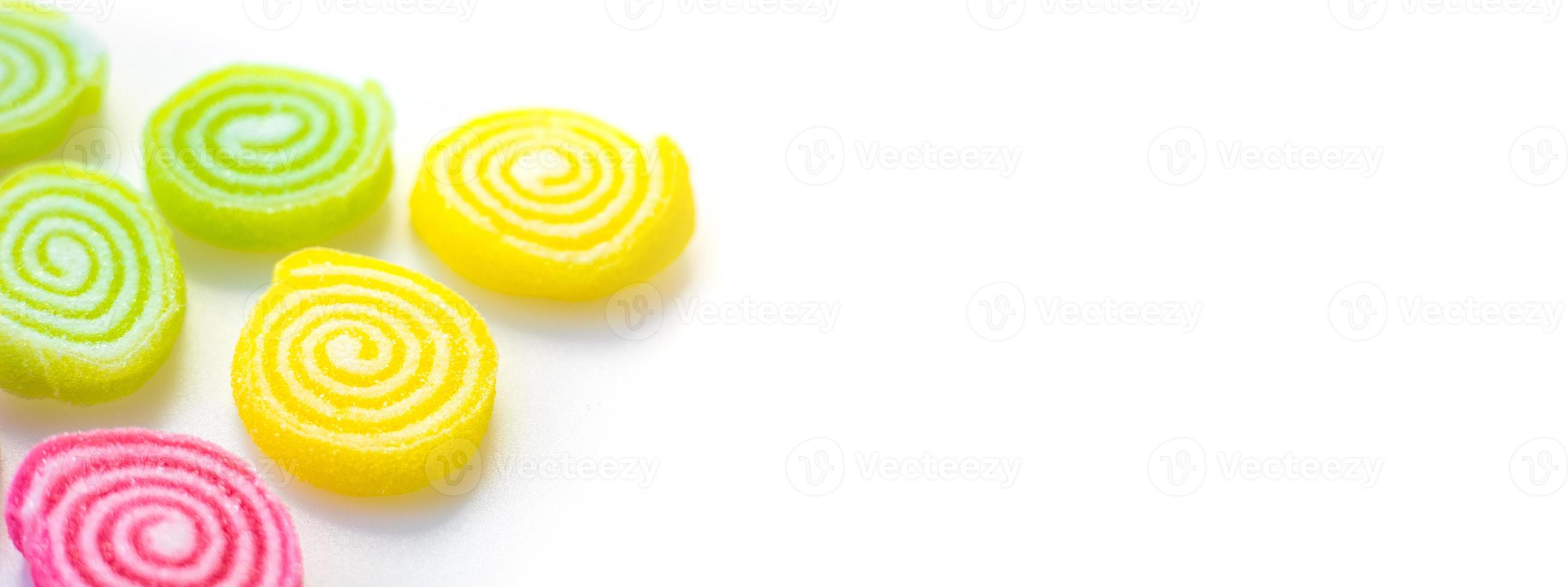 colorful sweets and sugar candies on a white background photo