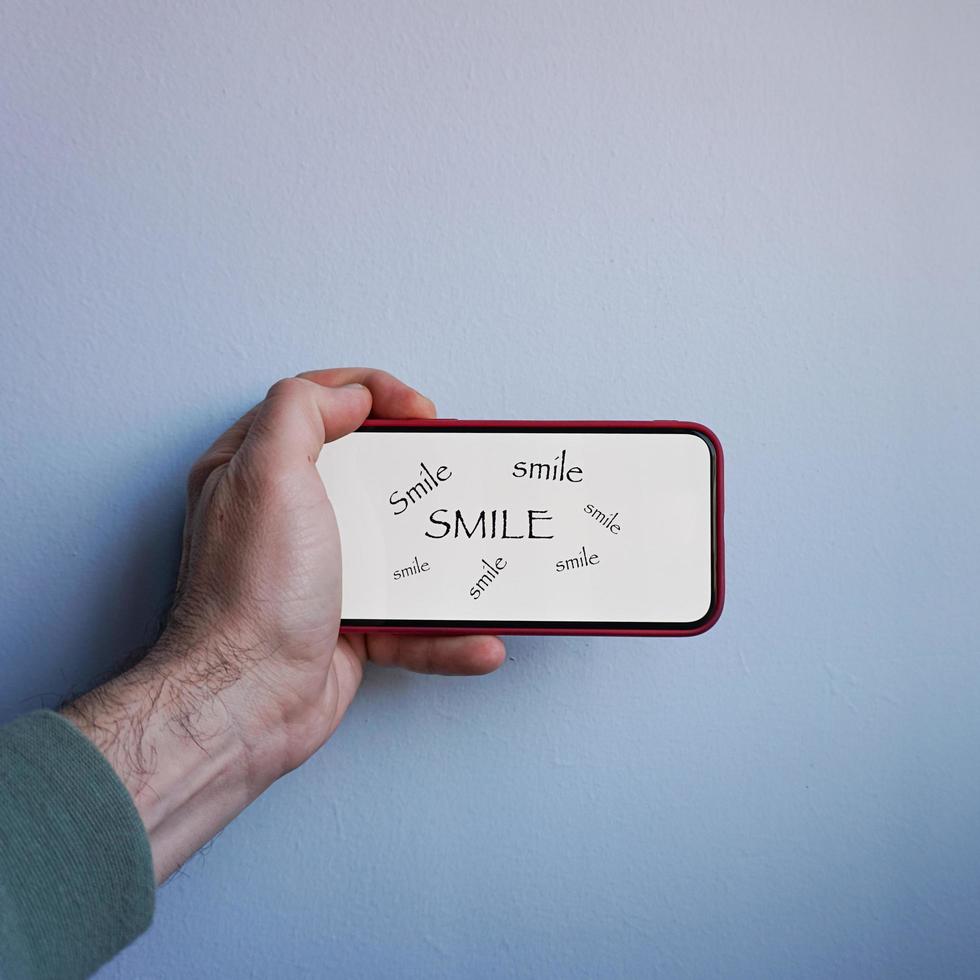 word smile on the phone, feelings and emotions photo
