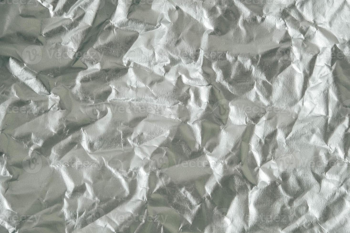 Crumpled foil as a background texture. Copy, empty space for text photo