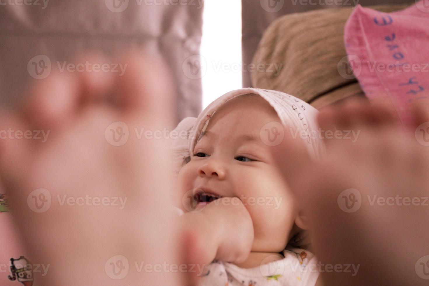 An Asian baby feels happiness. photo