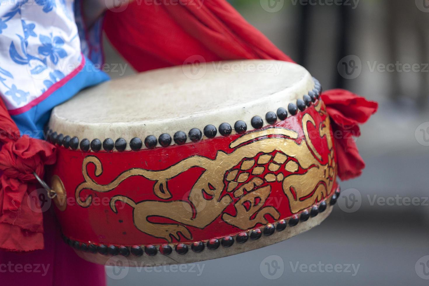 Musician playing with a Lion Drum photo