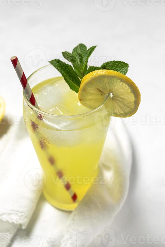 Fresh Lemonade or mojito cocktail with lemon, mint and ice photo