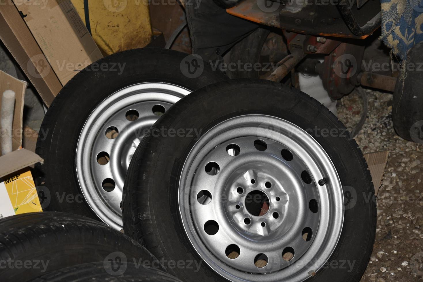 New tire with rubber on the iron disc of the car photo