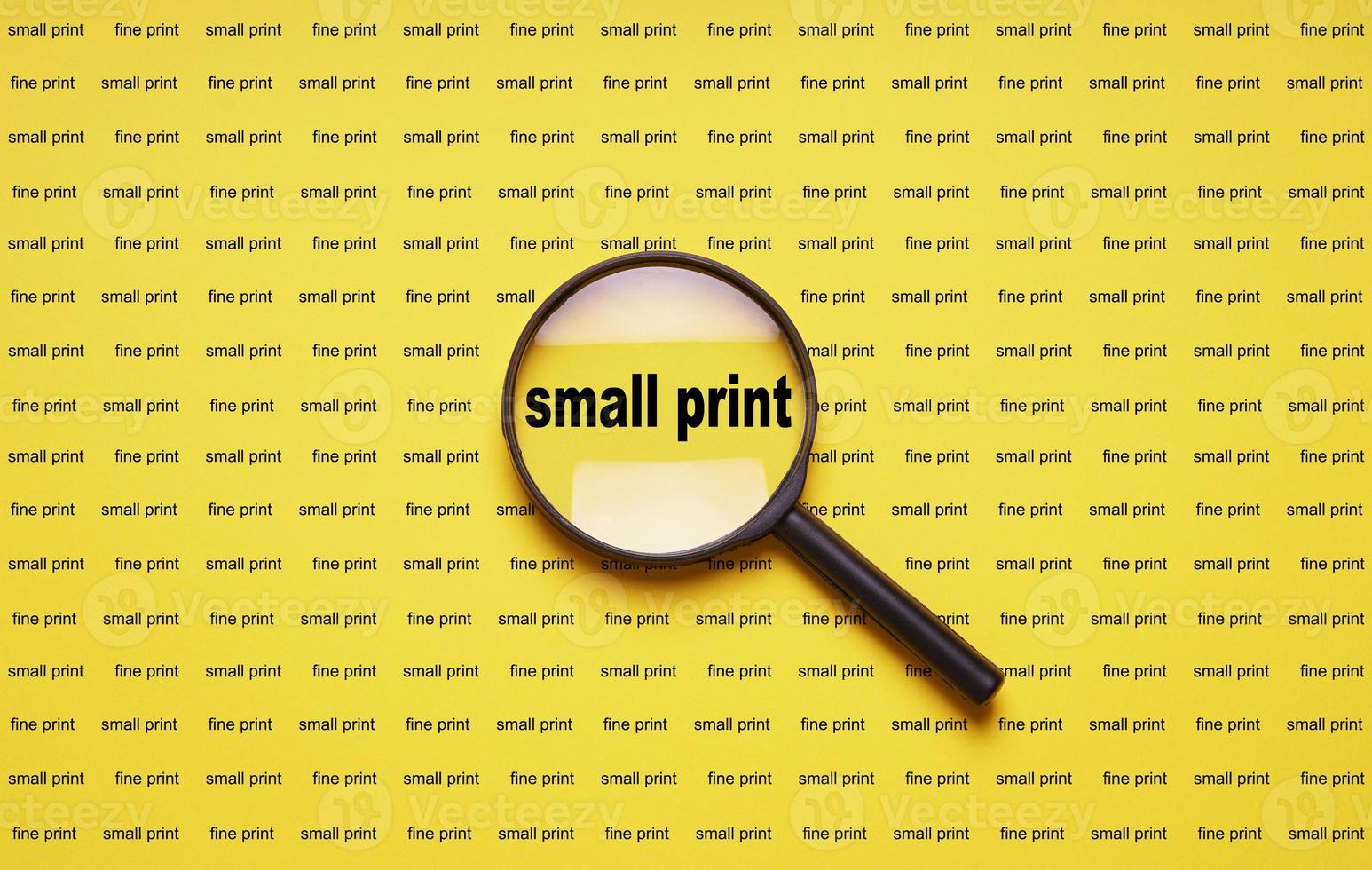 small print enlarged with magnifying glass magnifier loupe photo