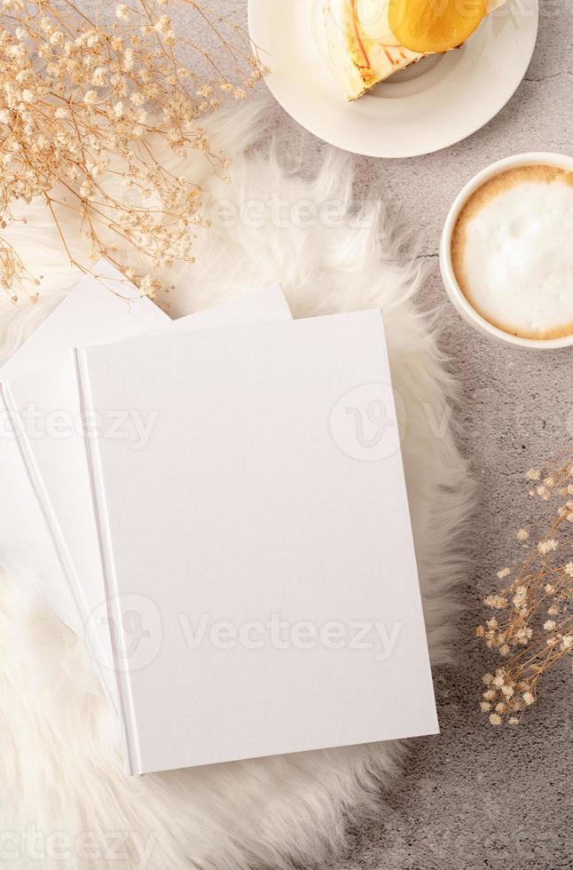 blank calendar mockup with carrot cake dessert, coffee and flowers on white rug photo