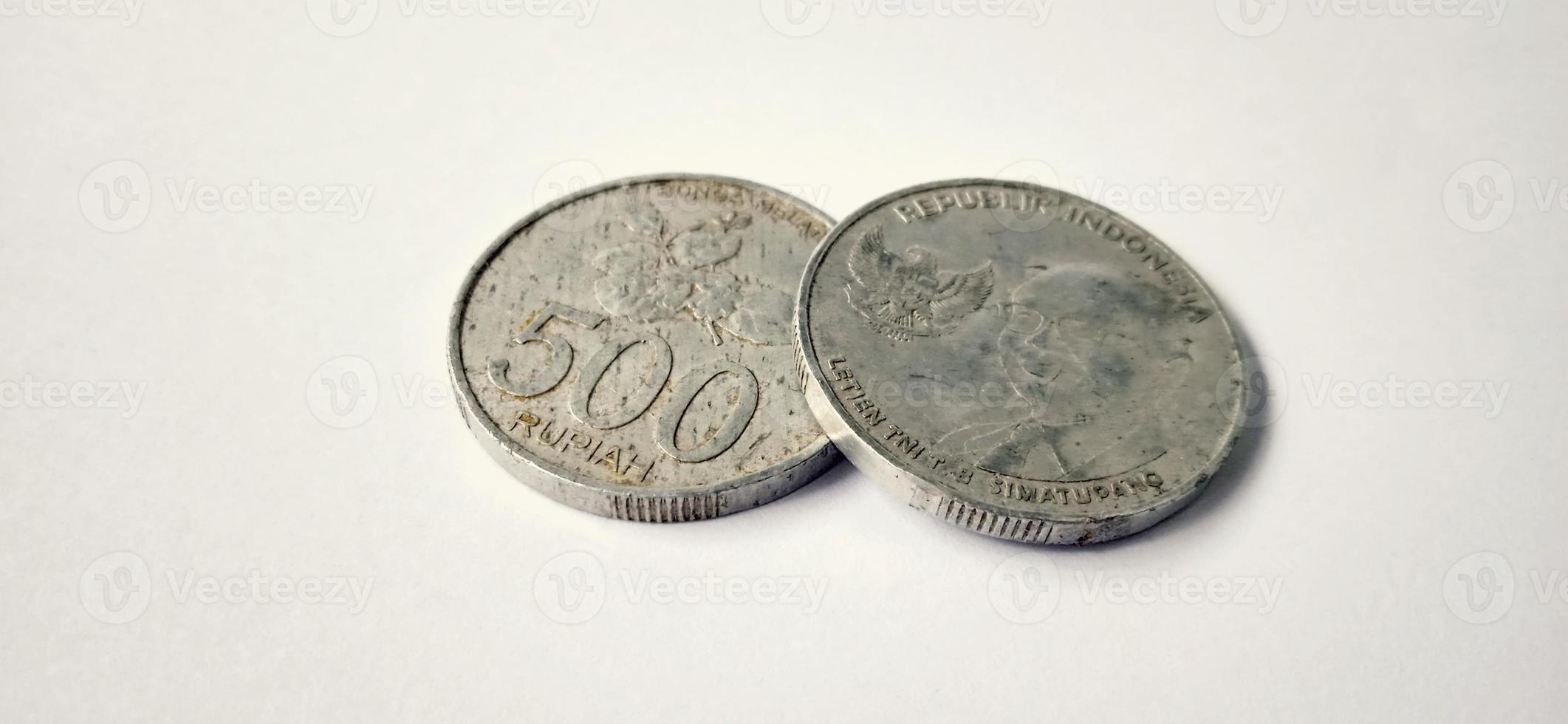 Two side of old 500 rupiah coin from Bank Indonesia with a grey background. Made of year is 2016. Indonesian rupiah, 500 Rupiah, Indonesian currency, Indonesian money background. photo