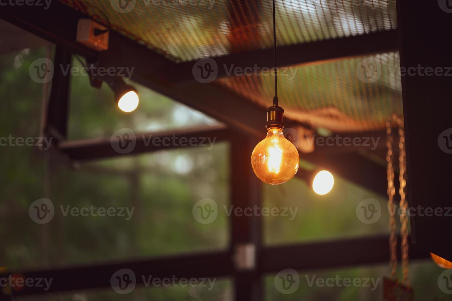 Decorative lamps in the cafe give a warm feeling. coffee shop decoration ideas photo