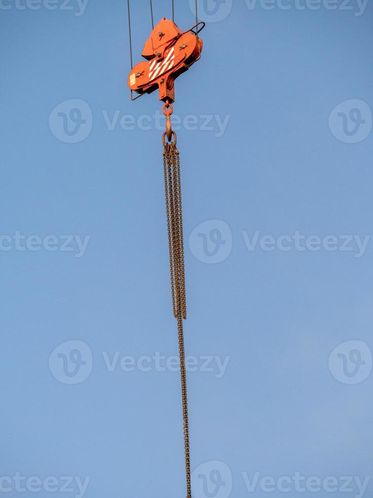 details of a large construction crane in the sun photo