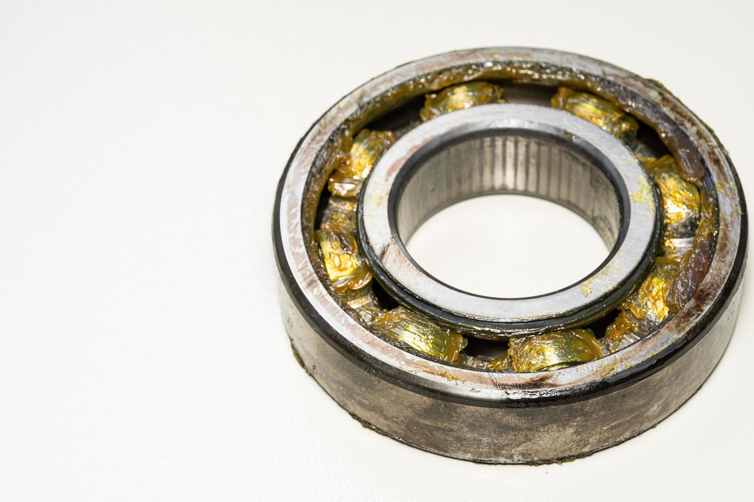old bearing car.expire bearing car isoleted on white background. old rusty ball bearing photo