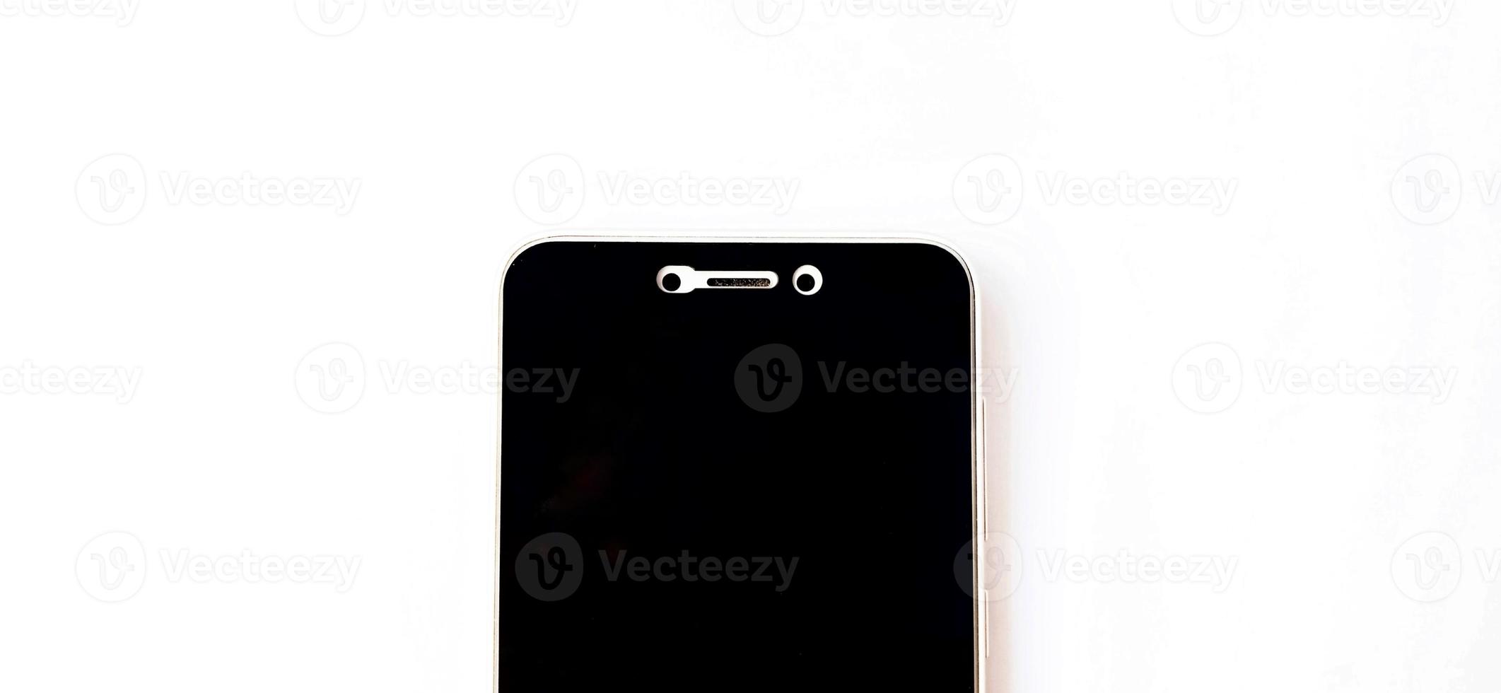 Black screen of smartphone device with a white background. Suitable for company and phone industry promotion, backdrop, poster, tech advertising, etc. photo