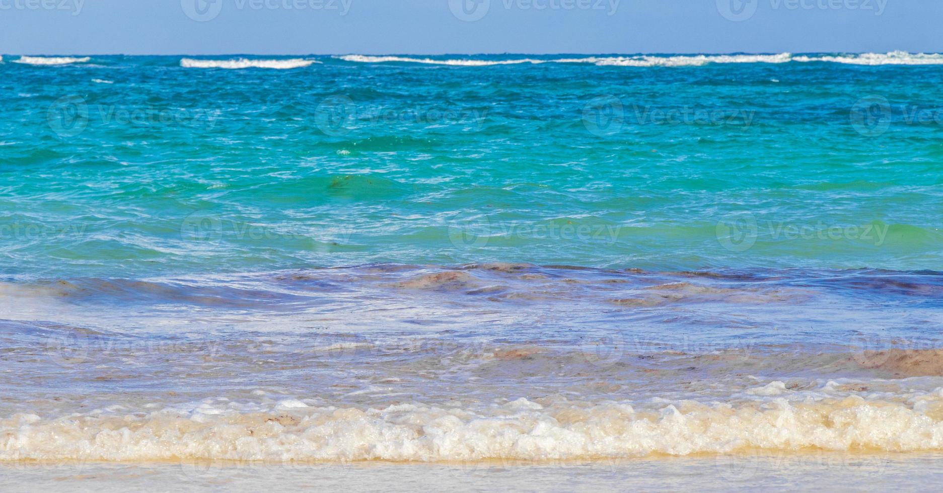 Waves water caribbean coast and beach panorama view Tulum Mexico. photo