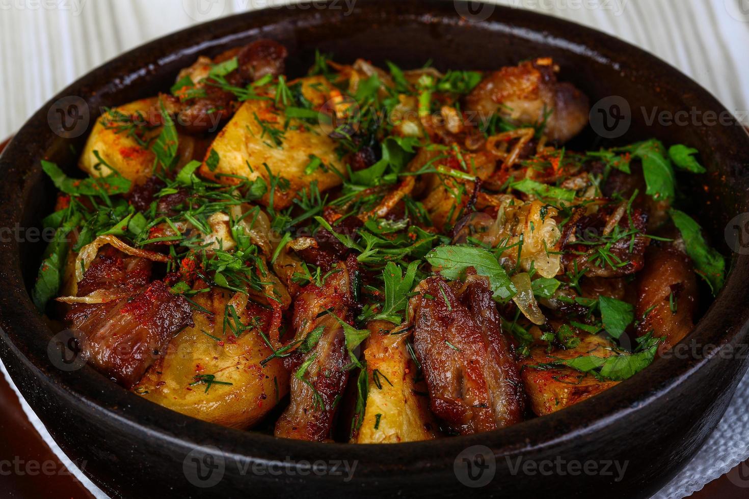 Baked potato with pork meat photo