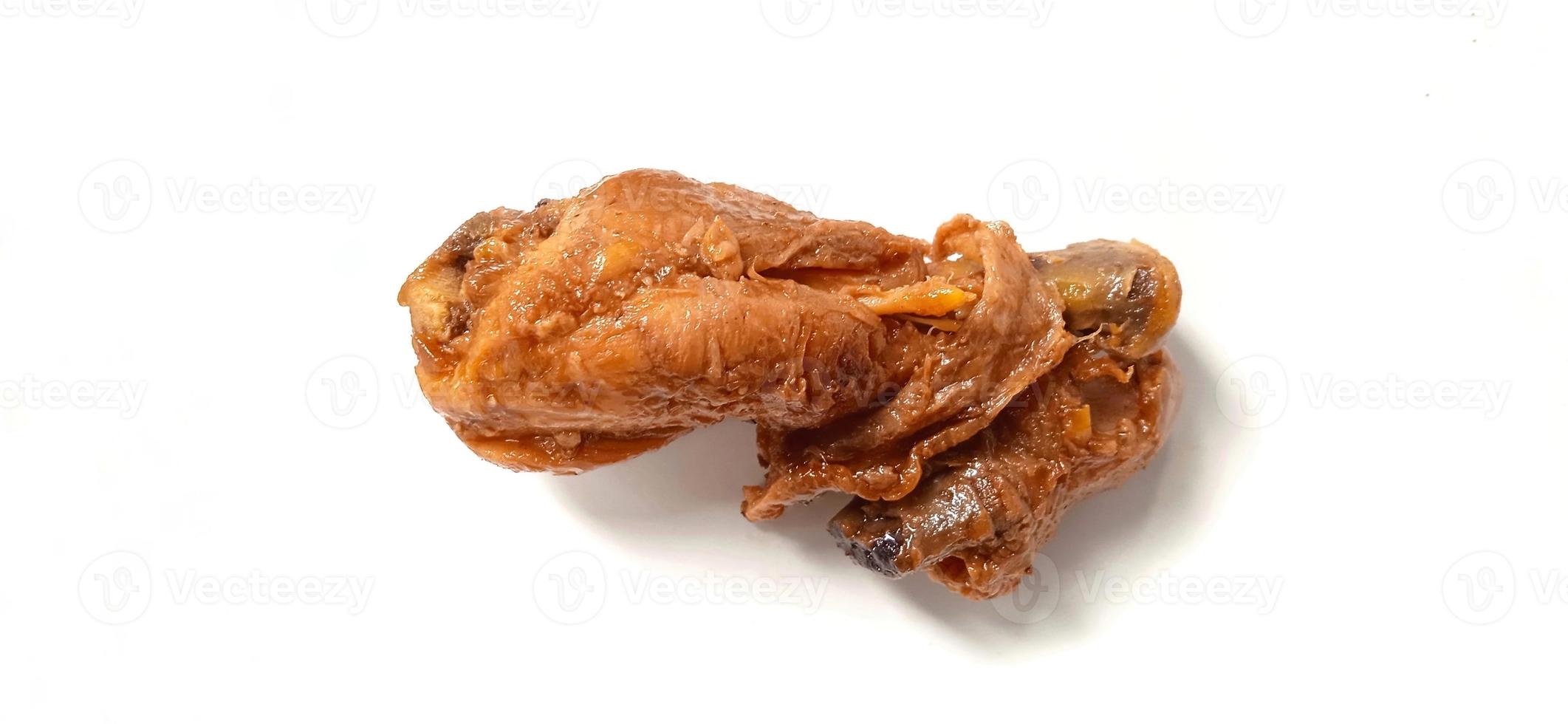 A brown chicken with sweet soy sauces under white gray plate background. Food ingredient background design. Suitable for advertising of food, drink, poster, backdrop, food company and industry. photo