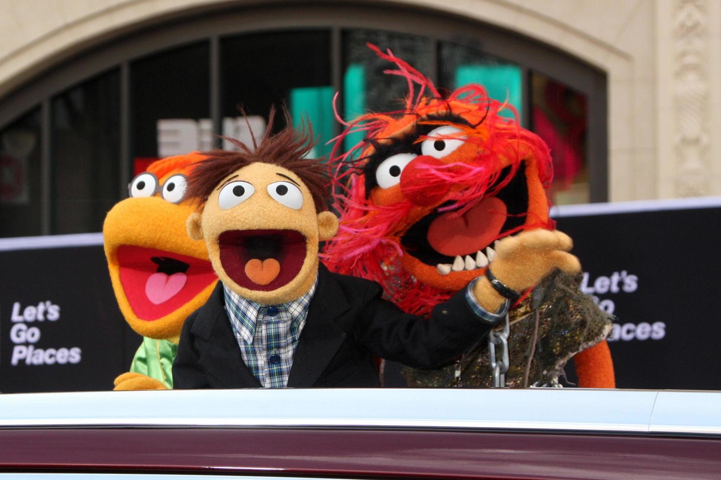 LOS ANGELES, MAR 11 -  Fozzie, Walter, Animal at the Muppets Most Wanted, Los Angeles Premiere at the El Capitan Theater on March 11, 2014 in Los Angeles, CA photo