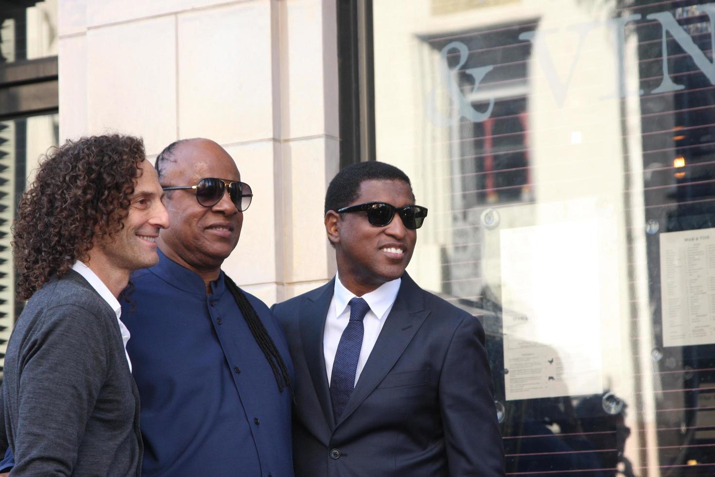 LOS ANGELES, OCT 10 -  Kenny G, Stevie Wonder, Kenny Babyface Edmonds at the Kenny Babyface Edmonds Hollywood Walk of Fame Star Ceremony at Hollywood Boulevard on October 10, 2013 in Los Angeles, CA photo