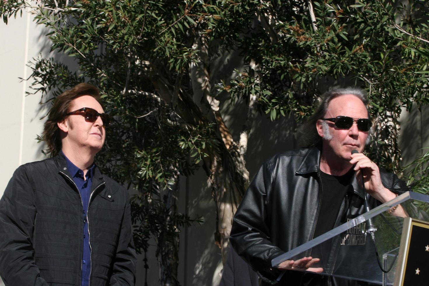 LOS ANGELES, FEB 9 - Paul McCartney, Neil Young at the Hollywood Walk of Fame Ceremony for Paul McCartney at Capital Records Building on February 9, 2012 in Los Angeles, CA photo