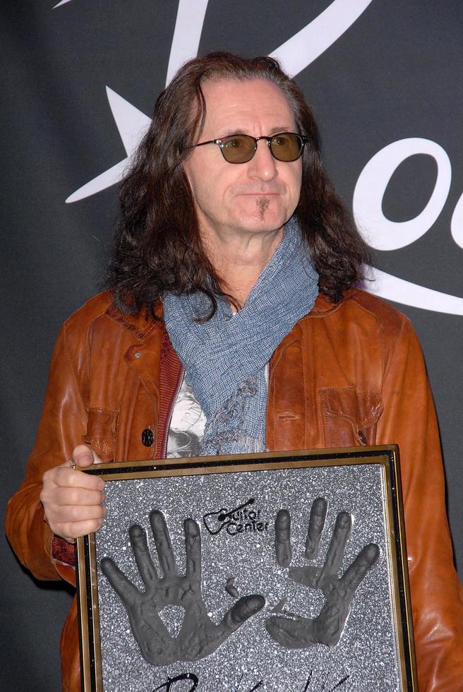 LOS ANGELES, NOV 20 - RUSH, Geddy Lee, Neil Peart, Alex Lifeson at the ceremony where RUSH is Inducted Into Guitar Center s RockWalk at Guitar Center on November 20, 2012 in Los Angeles, CA photo