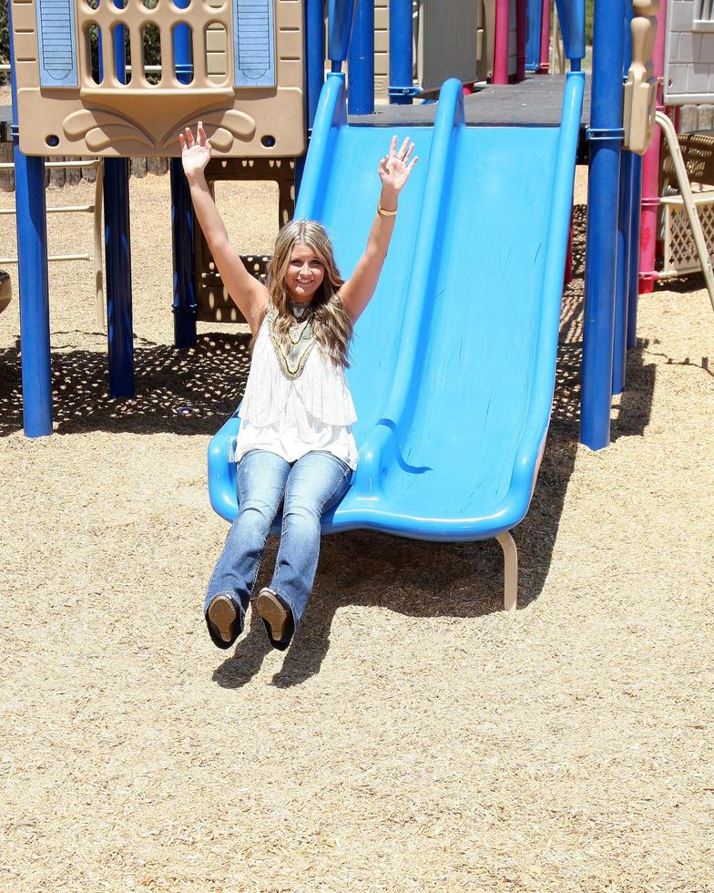 LOS ANGELES, AUG 1 - Savannah Outen playing in the park, wearing Wallflower jeans at Midtown LA on August 1, 2011 in Los Angeles, CA photo