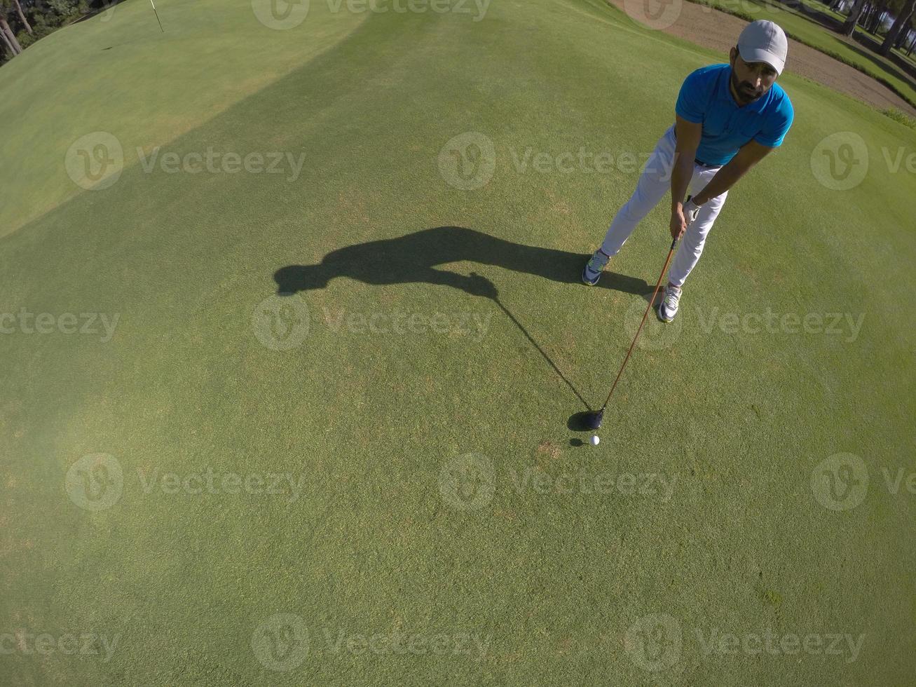 top view of golf player hitting shot photo