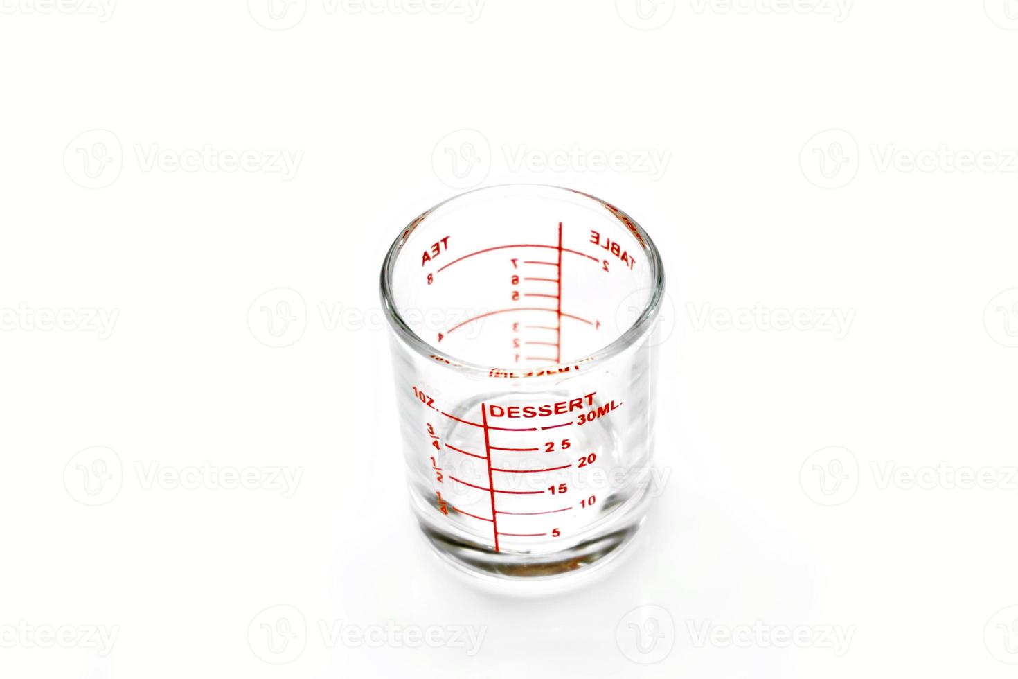 medicine measuring glass cups isolate on white background. 11991688