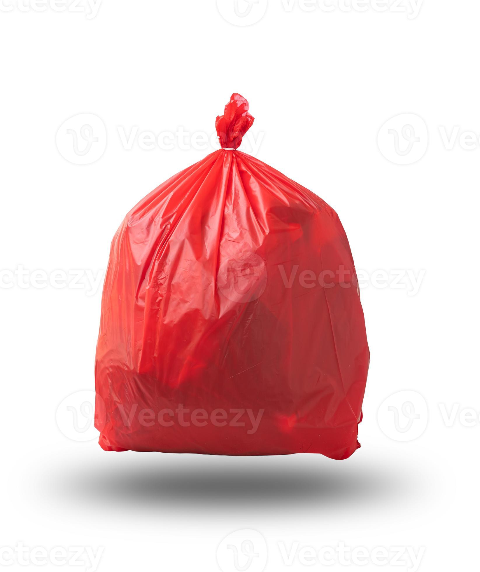 Hand holding Red garbage bag for infectious waste isolated on white