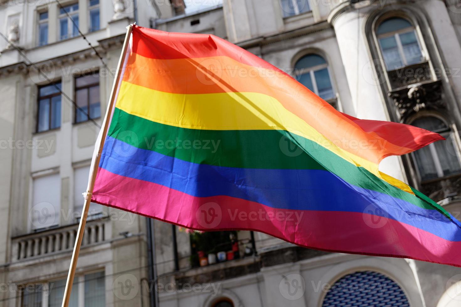 LGBTIQ March Pride. Colorful parade celebrating LGBTIQ rights. Protesters walking with banners and flags. Human rights. Pride, passion and protest. Rainbow families. Equality for all. photo