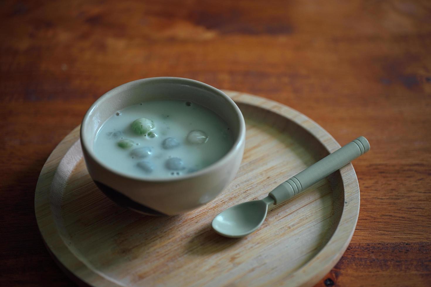 Thai sweetmeat with colorful ball flour. Thai glutinous rice balls in creamy coconut milk syrup. Famous Thai dessert Bualoy photo