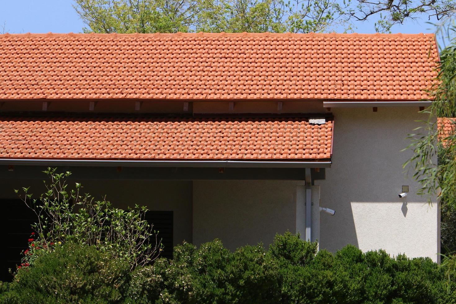 Karmiel Israel August 20, 2021. Red tiled roof of a residential building photo