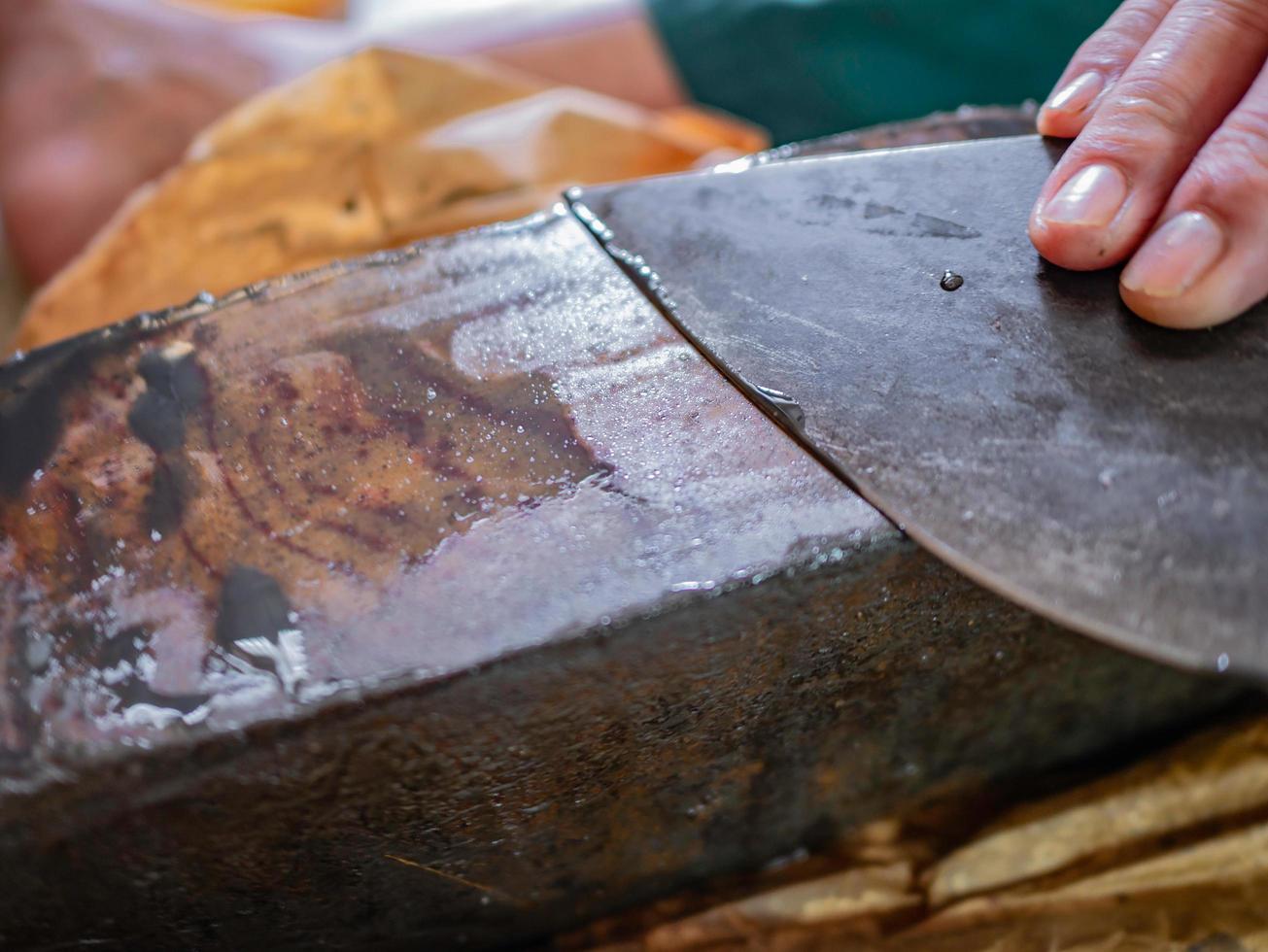 Close up People sharpe the cleaver knife on the whetstone photo