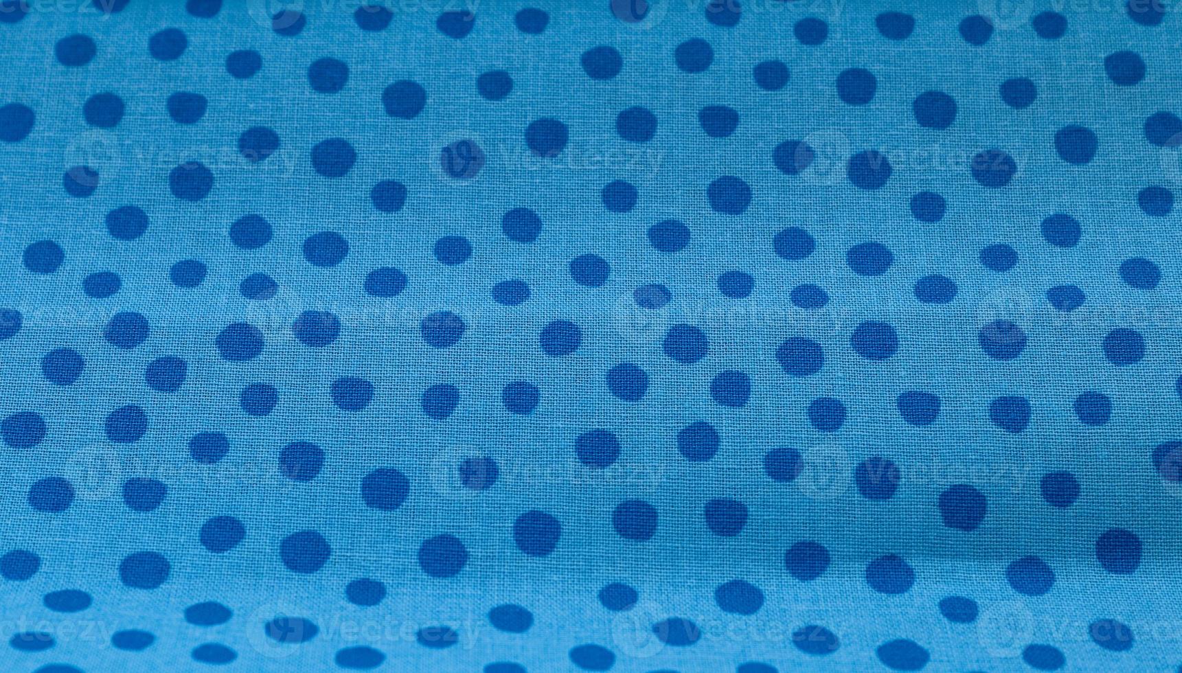 Close up view on samples of cloth and fabrics in different colors found at a fabrics market photo