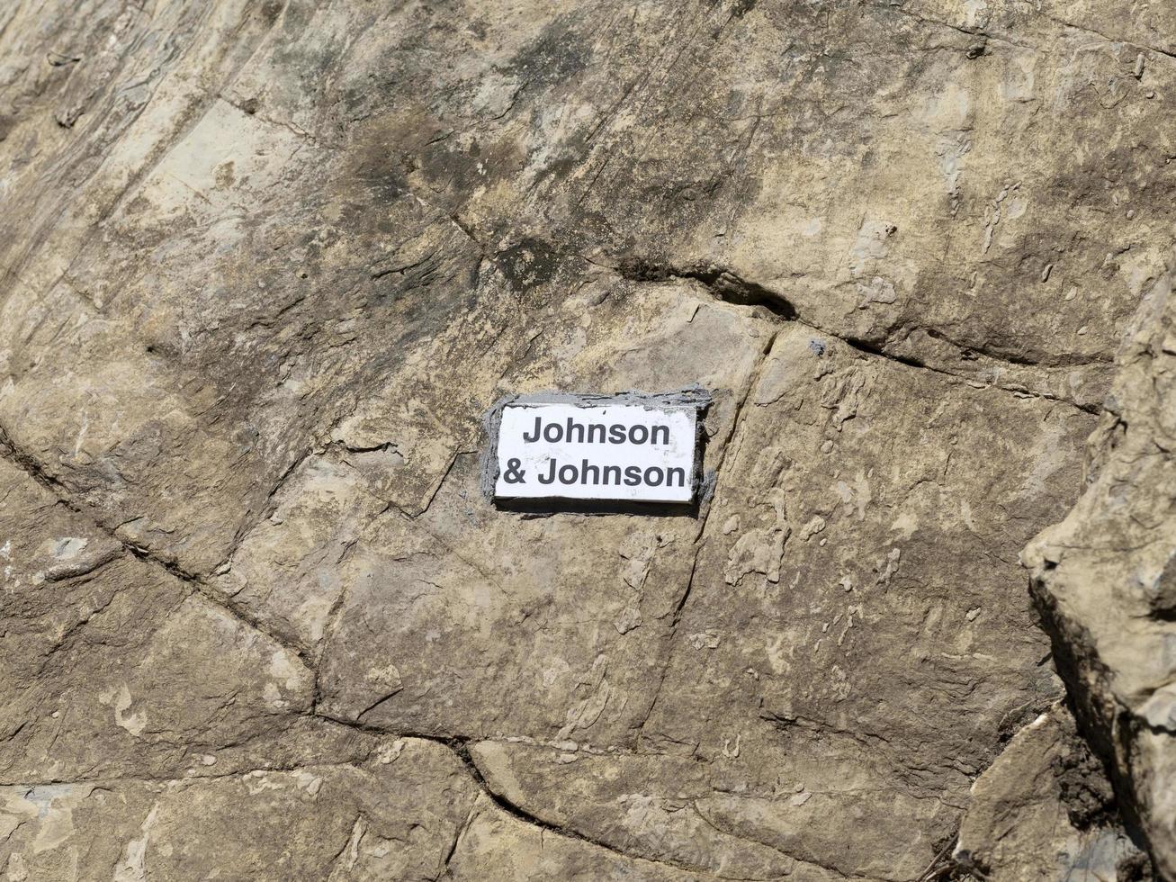 RECCO, ITALY - APRIL 26 2021 - Johnson Vaccine name on stone behind the church photo