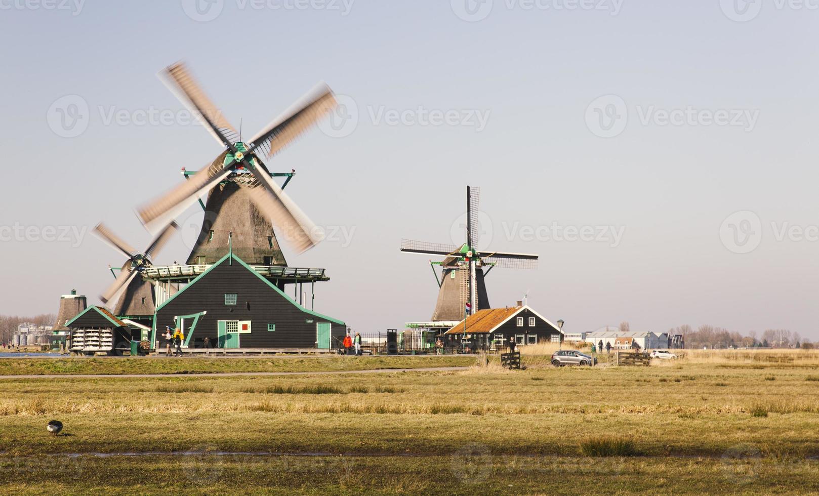 old Dutch mills in motion located in the city of Amsterdam photo