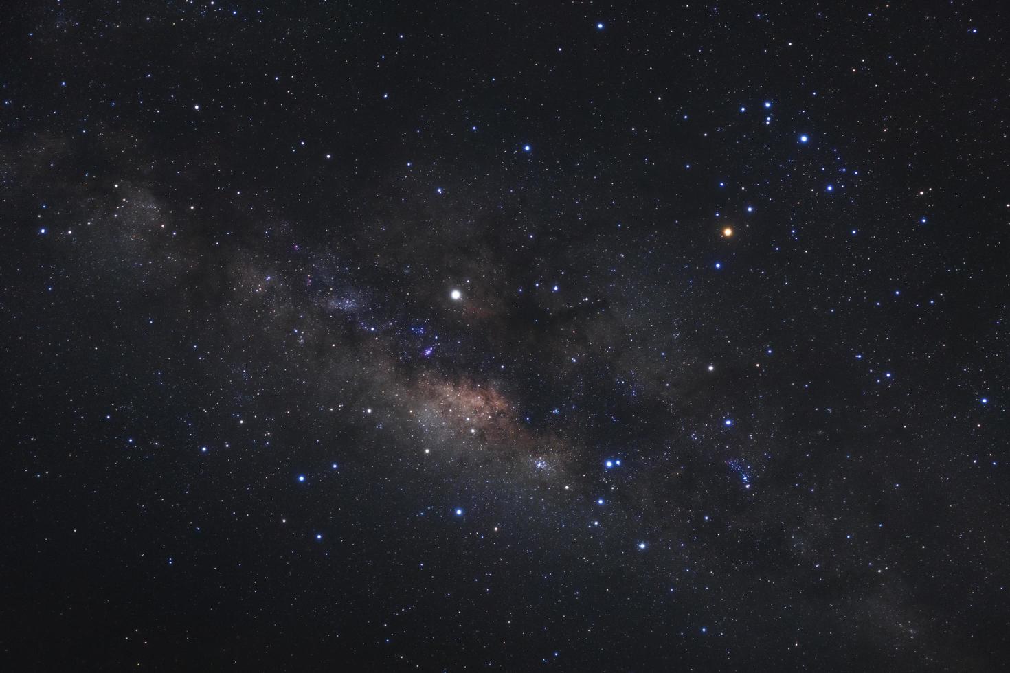 Close up milky way galaxy with stars and space dust in the universe, Long exposure photograph, with grain. photo